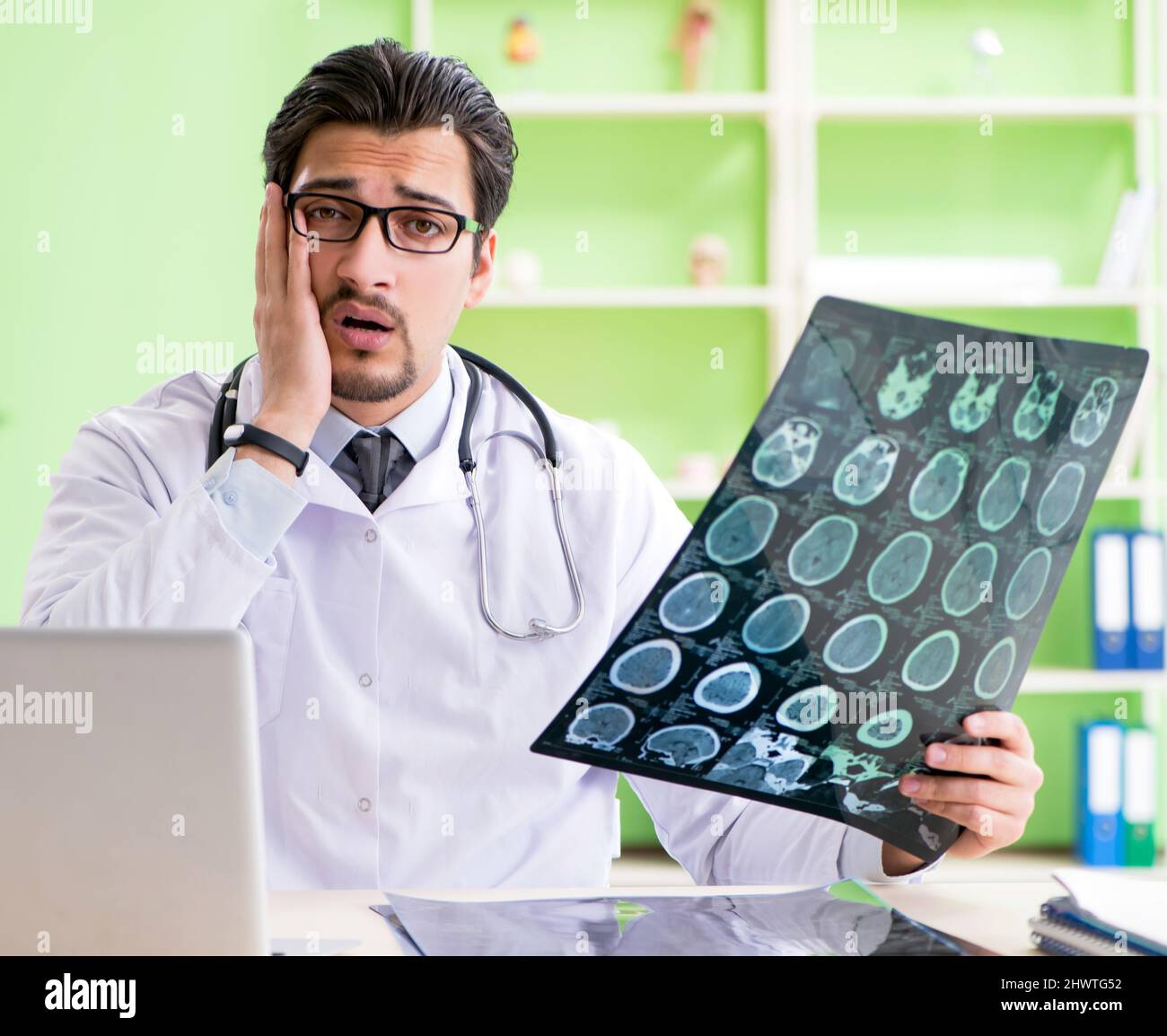 The doctor radiologist looking at xray scan in hospital Stock Photo