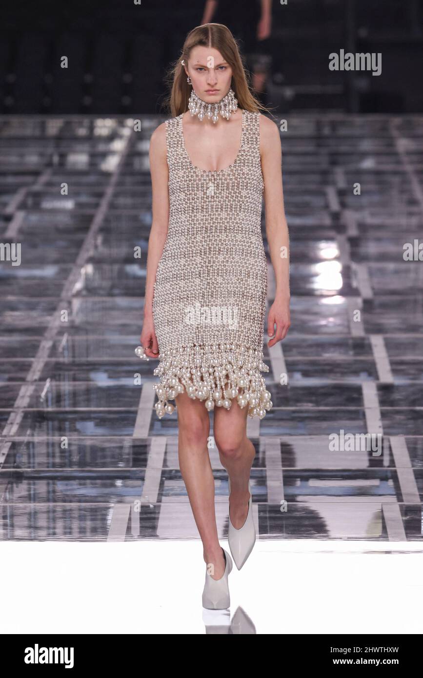 A model walks on runway of a fashion show in Paris, France and wears a Givenchy Women and Men