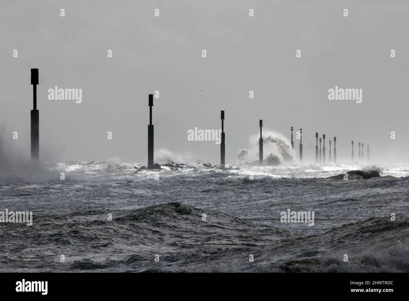 the North Sea breaking against the off-shore coastal defence reefs on a stormy morning  Eccles-on-Sea, Norfolk, Uk       February Stock Photo