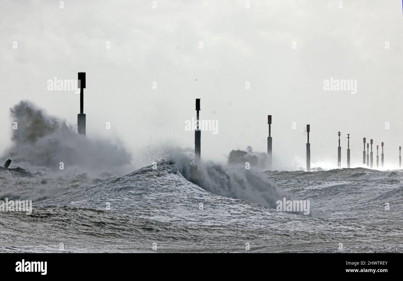 the North Sea breaking against the off-shore coastal defence reefs on a stormy morning  Eccles-on-Sea, Norfolk, Uk       February Stock Photo
