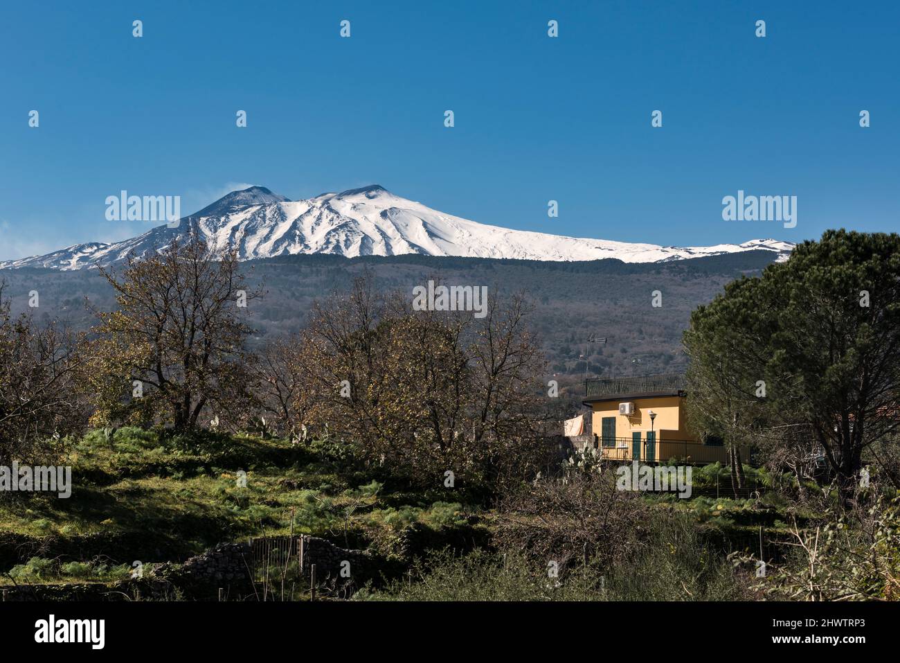A view of Mount Etna in late winter, seen from outside the town of Linguaglossa to the north-east of the volcano (Sicily, Italy) Stock Photo
