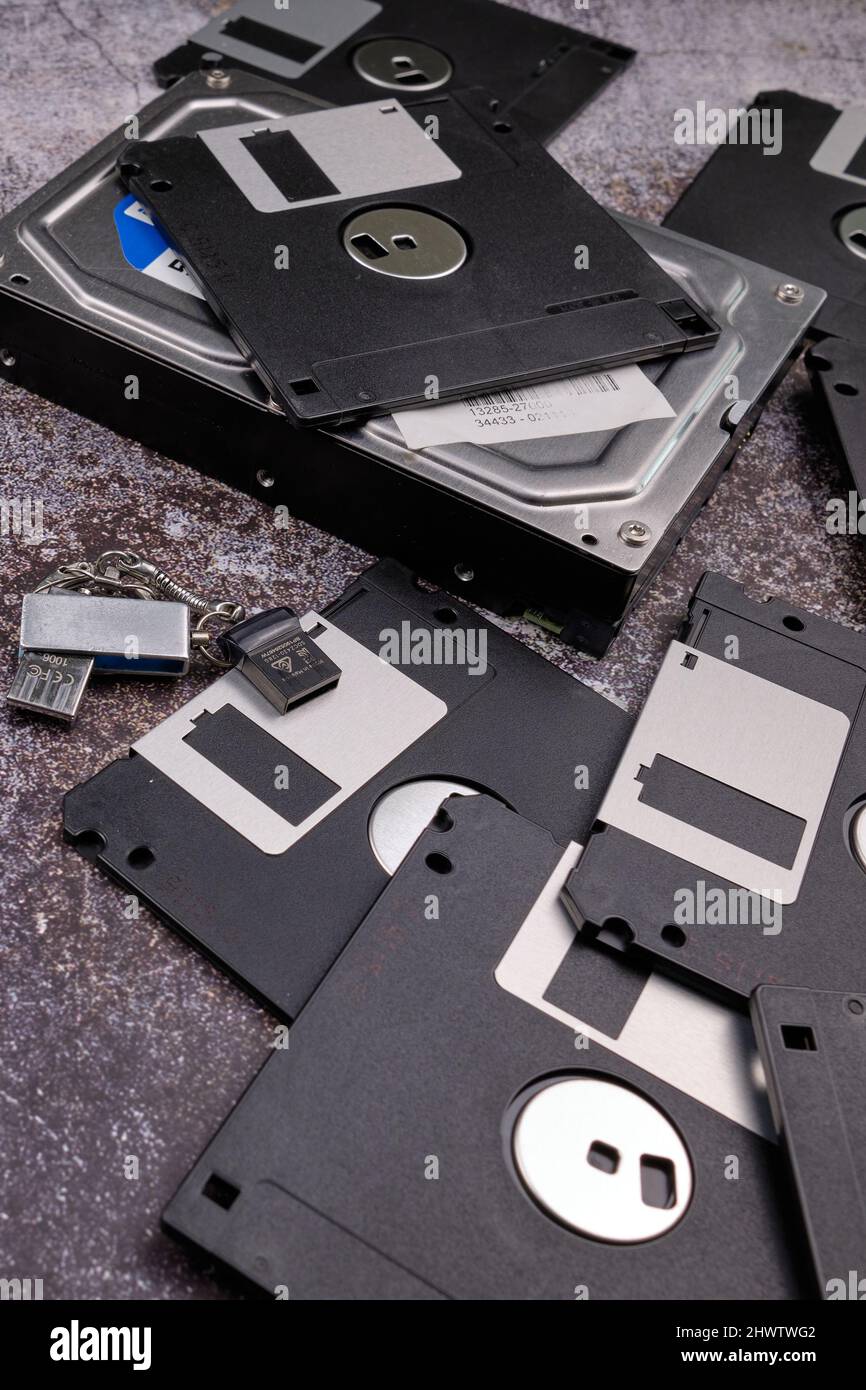 Composition of various computer components on a dark background similar to cement. Stock Photo