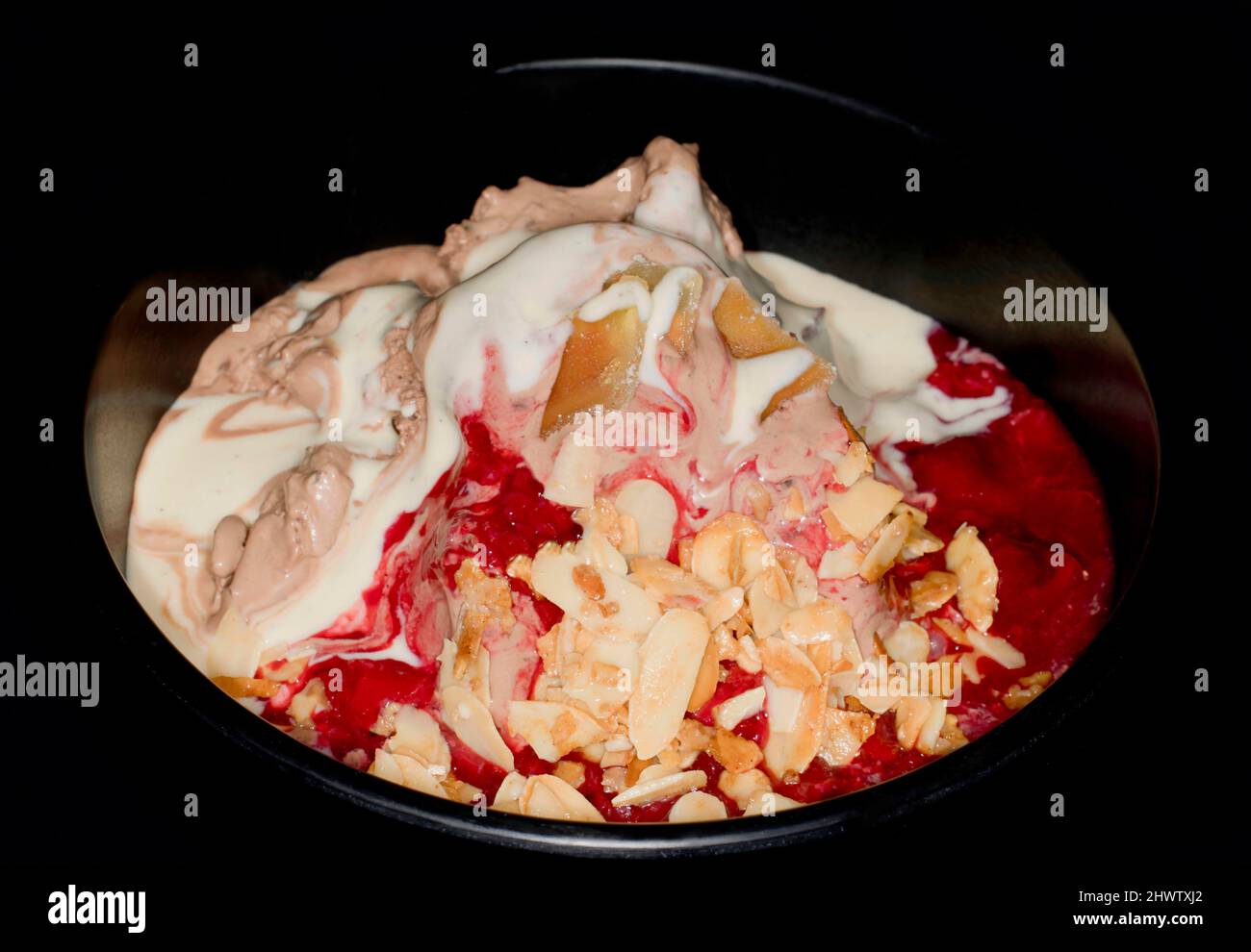 Ice cream with cherries and almonds Stock Photo