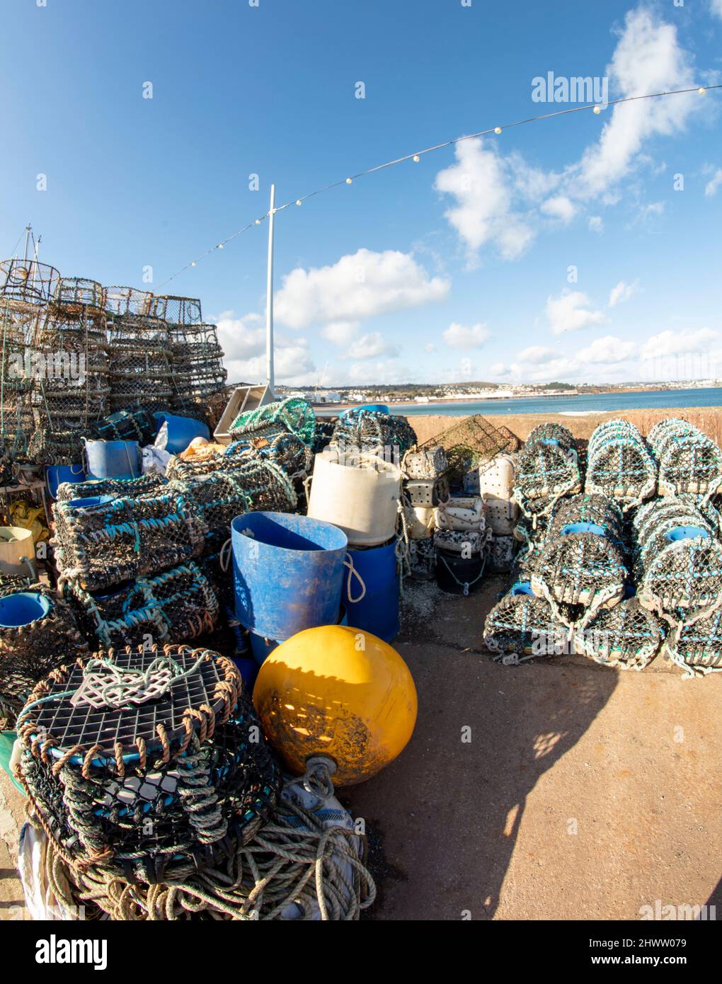 Stacked Crabpots in a wider attractive landscape at Paignton on the