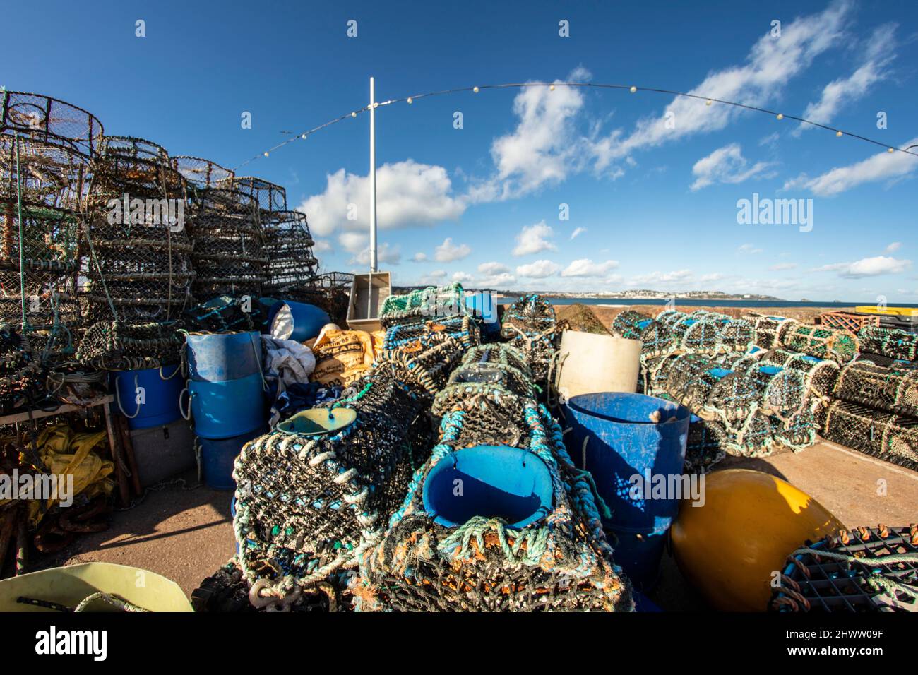 Stacked Crabpots in a wider attractive landscape at Paignton on the