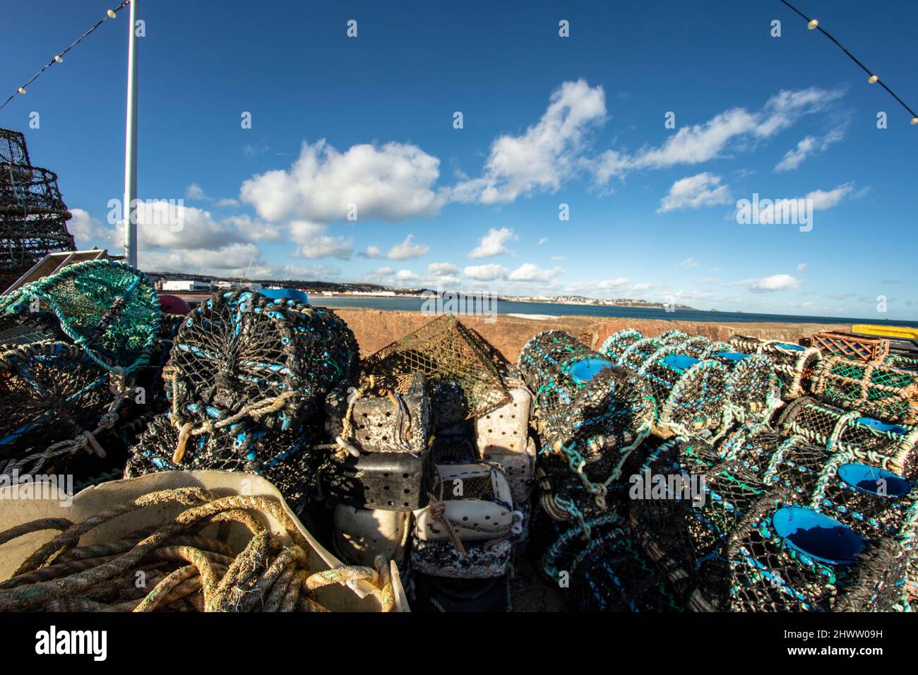 Stacked Crabpots in a wider attractive landscape at Paignton on the