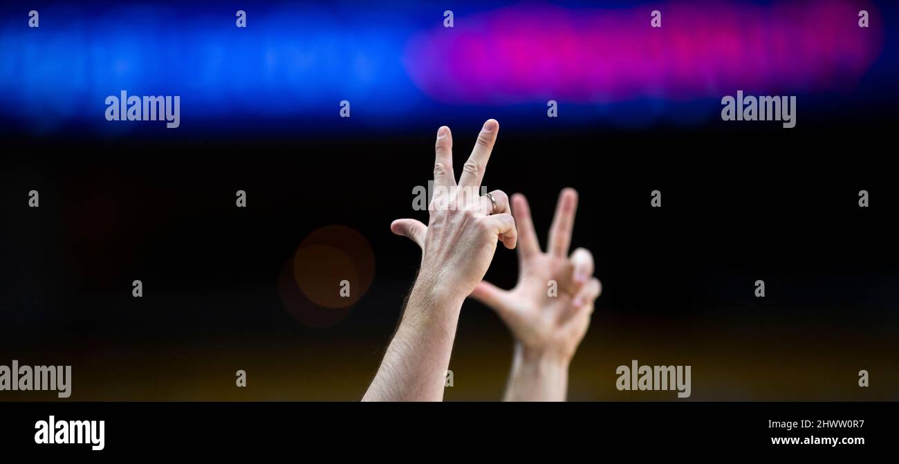 Basketball referee hands on arena background. Horizontal sport theme poster, greeting cards. Three points Stock Photo