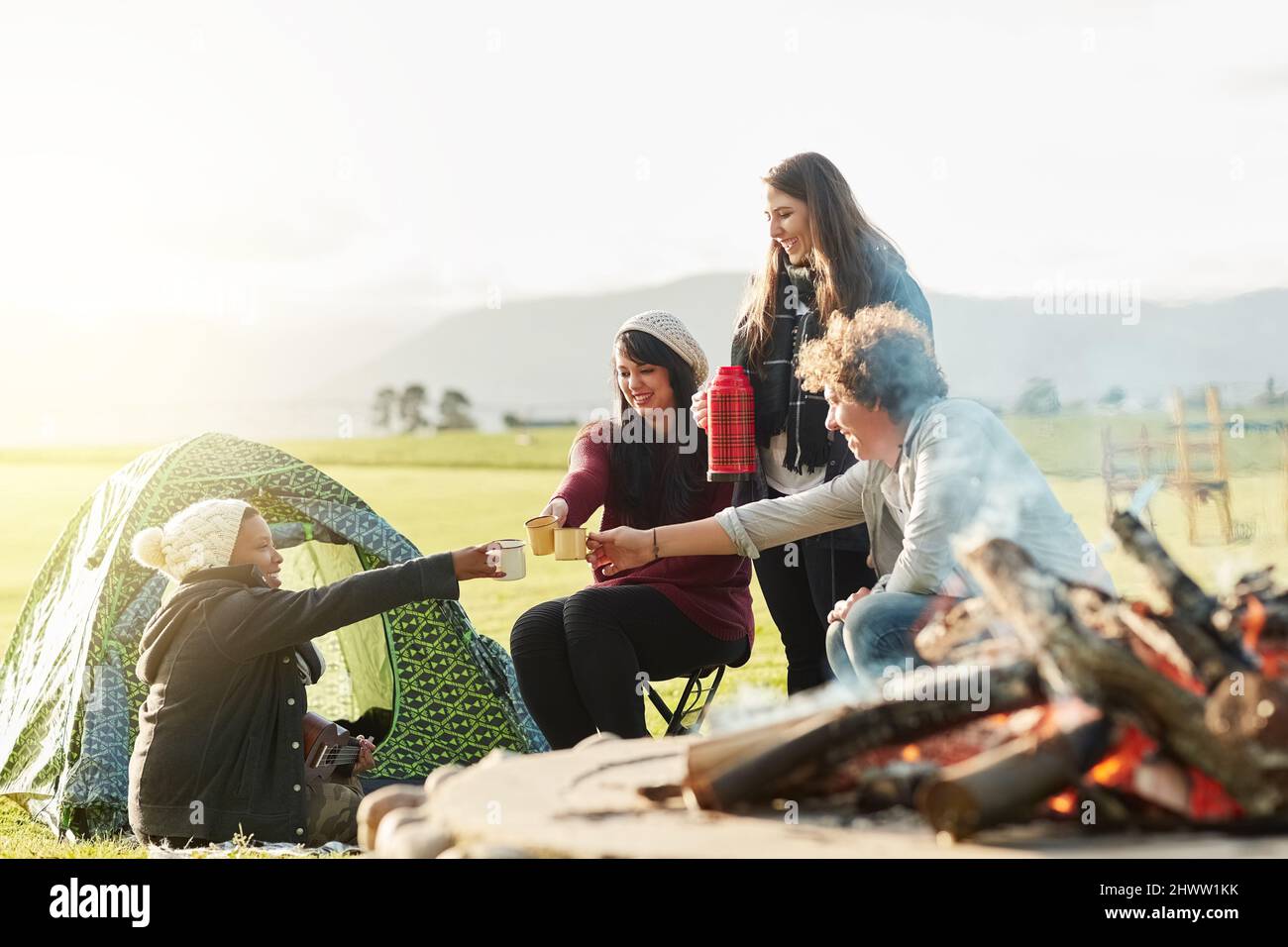 https://c8.alamy.com/comp/2HWW1KK/camp-coffee-is-the-best-coffee-shot-of-a-group-of-young-friends-enjoying-coffee-by-the-fire-while-on-a-camping-trip-2HWW1KK.jpg