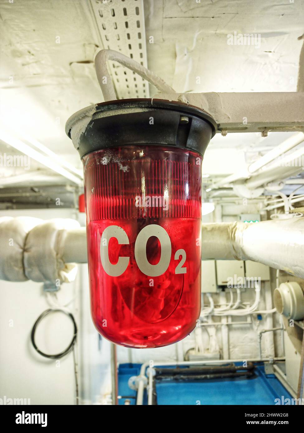 Red co2 alarm indicator in engine room for evacuating crew hires stock