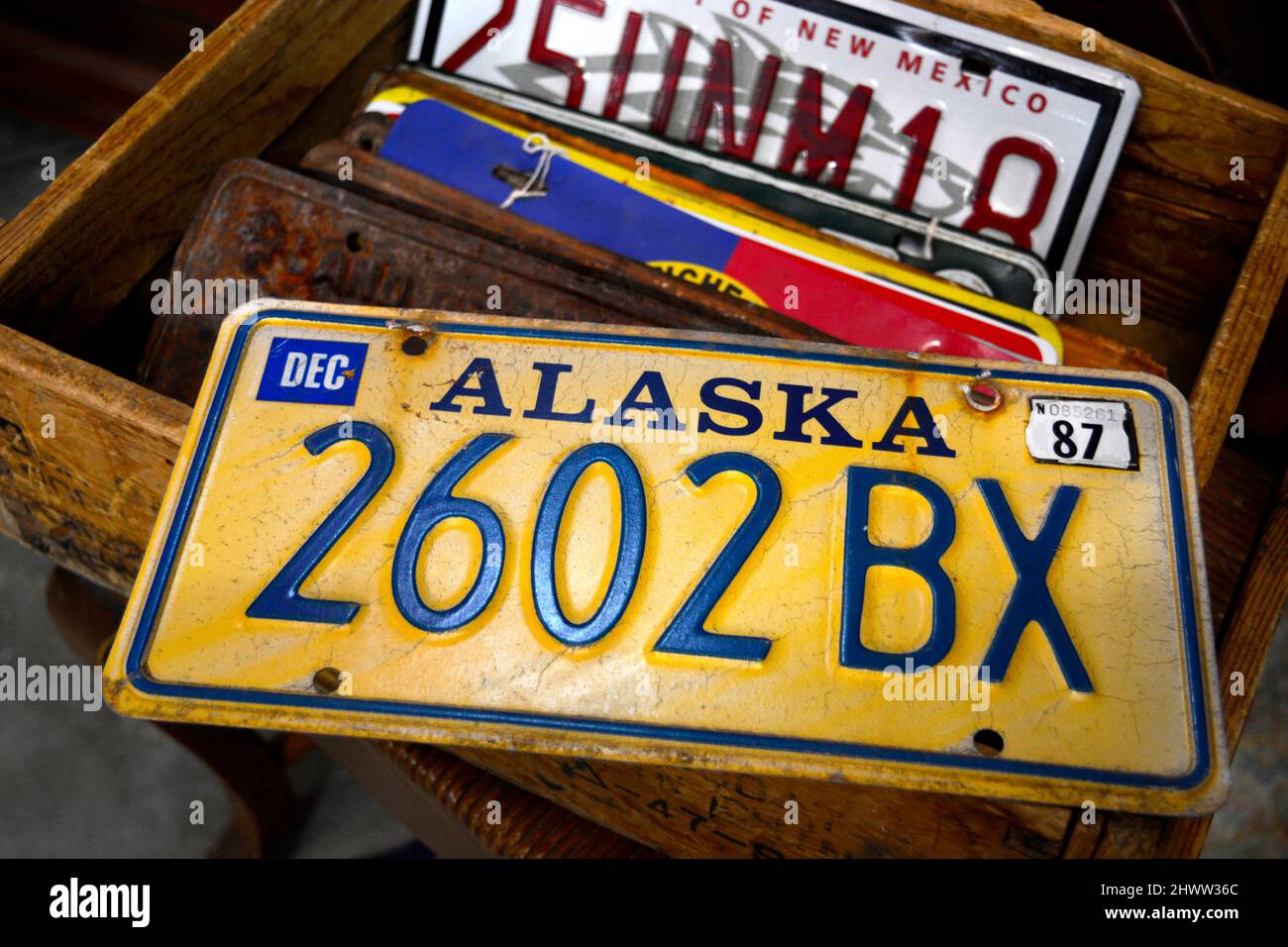 A 1987 Alaska automobile license plate for sale in an antique shop. Stock Photo