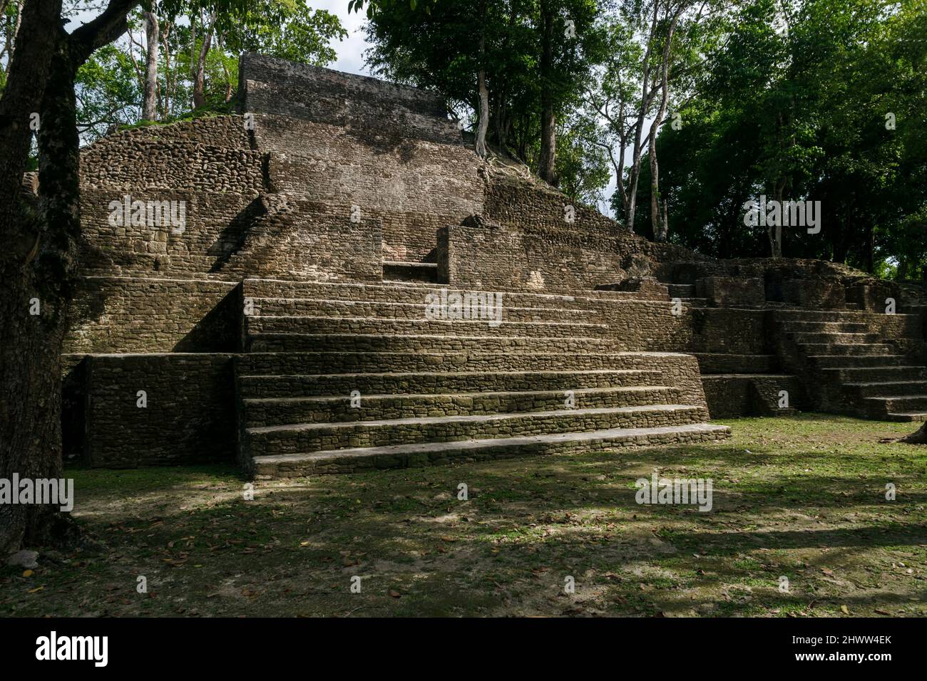 Pyramid at the Maya archeological site of 'Cahal Pech' in tropical forest, San Iganacio, Belize Stock Photo