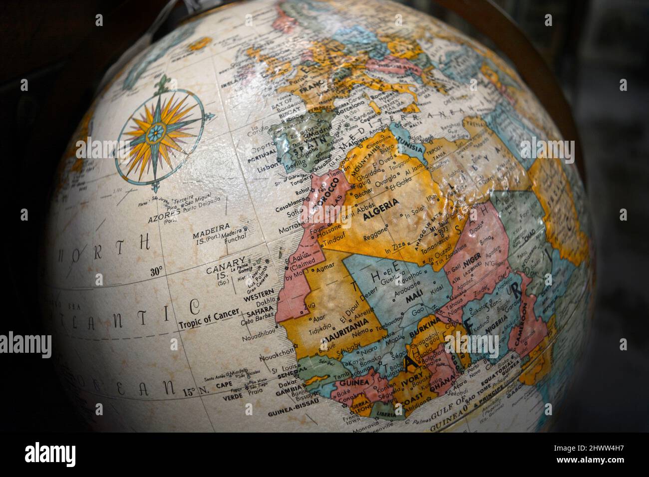 A vintage globe by Replogle, for sale in an antique shop, shows North African countries Algeria, Tunisia, Mauritania, Morocco and Atlantic Ocean. Stock Photo