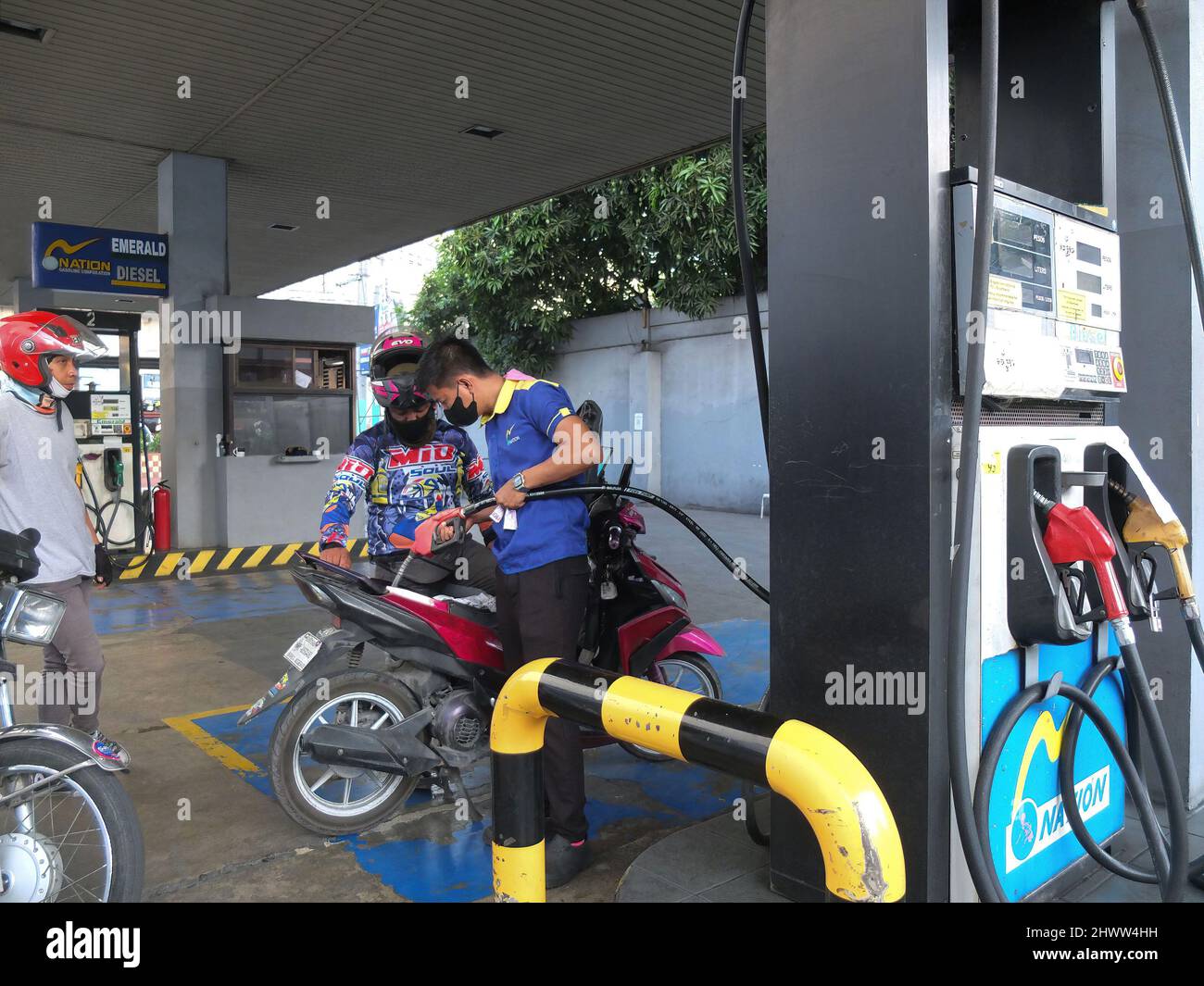 Caloocan, Philippines. 7th Mar, 2022. The gasoline attendant pull his