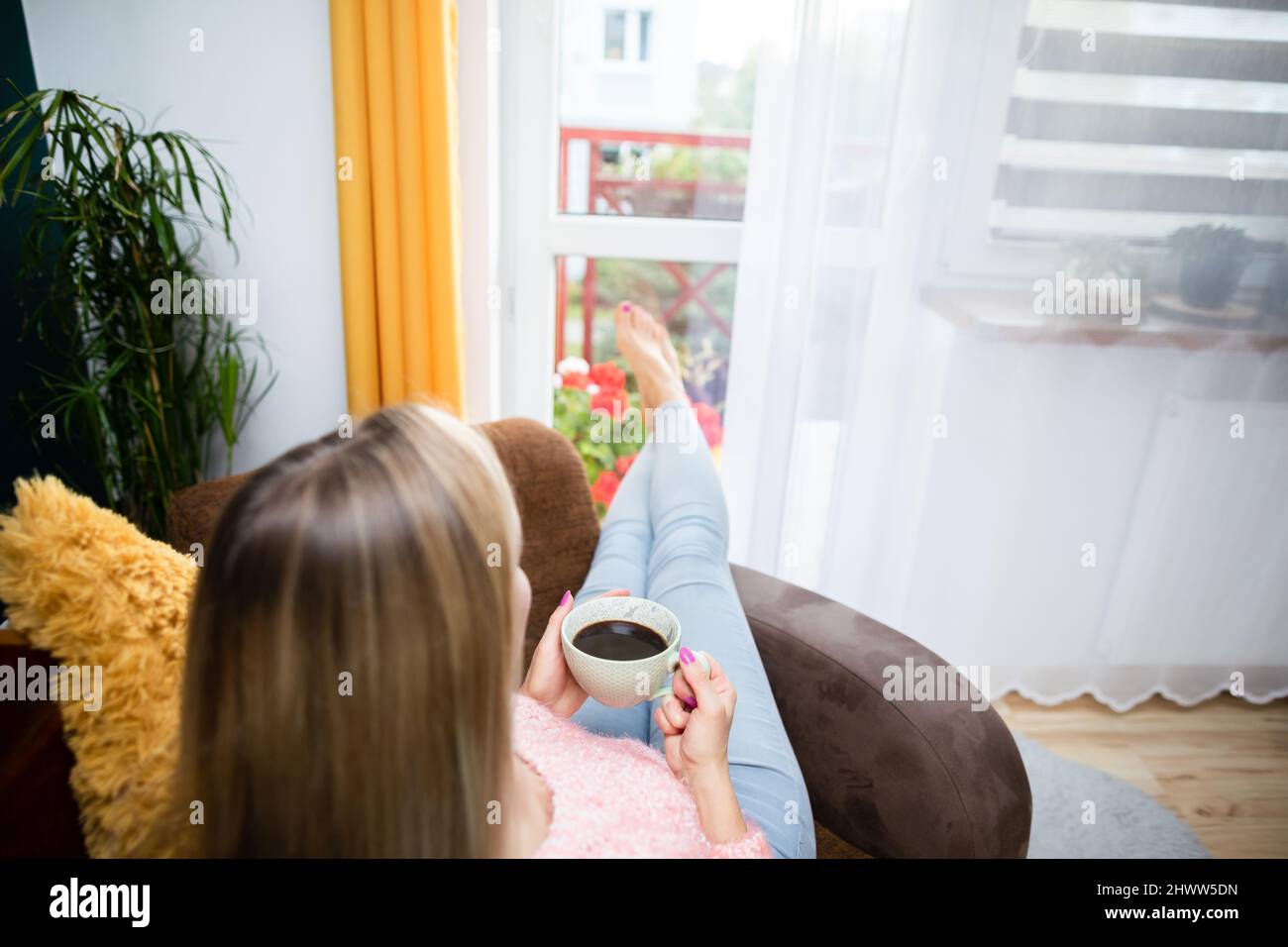 Relax with an aromatic coffee after a hard day at work. Stock Photo