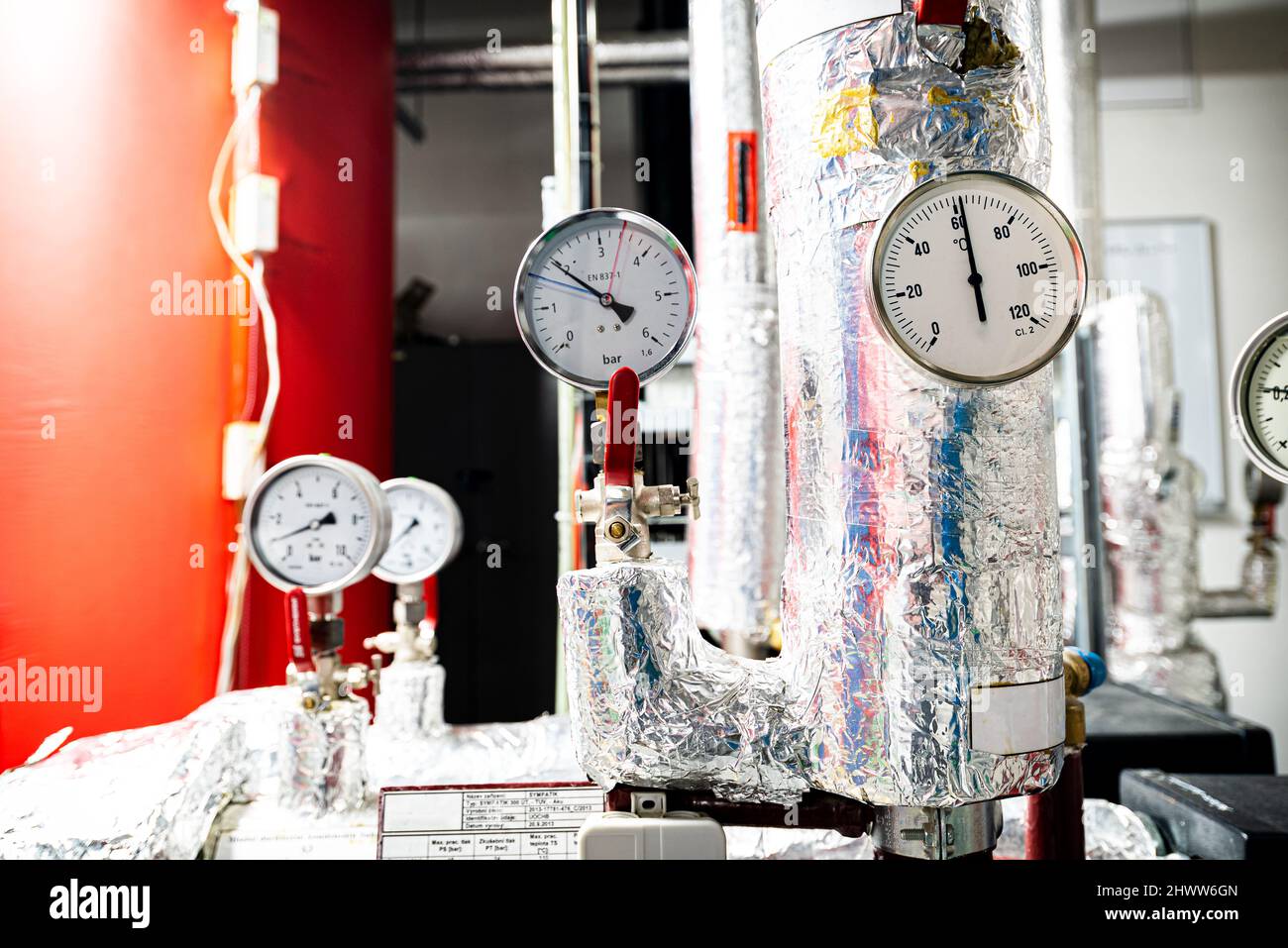 Barometers on pressure pipes, underground premises of the factory Stock