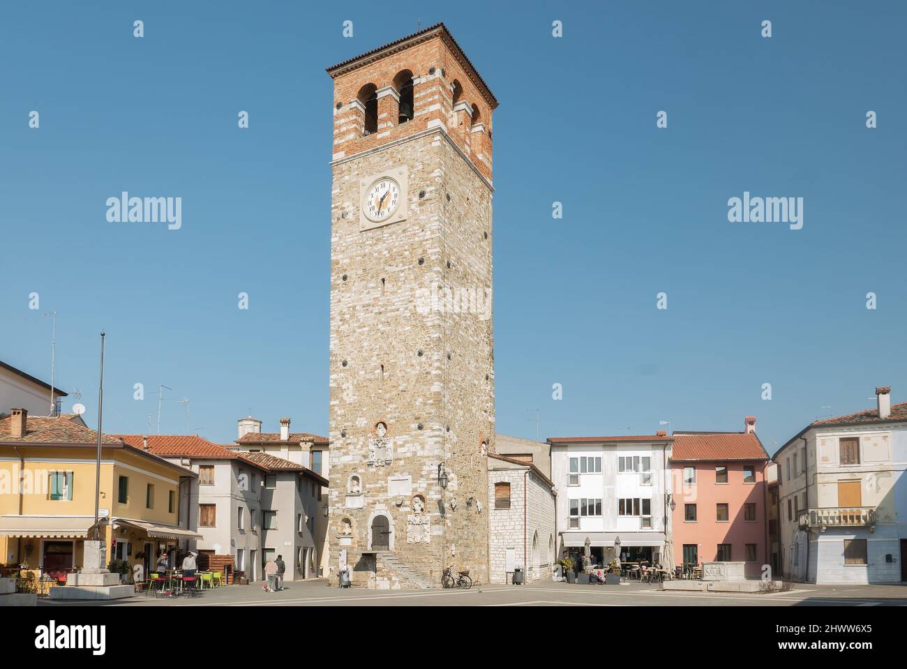 Marano Lagunare, Italy (6th March 2022) - The ancient and typical Piazza Vittorio Emanuele II Square with its 'Torre Millenaria' medieval tower Stock Photo