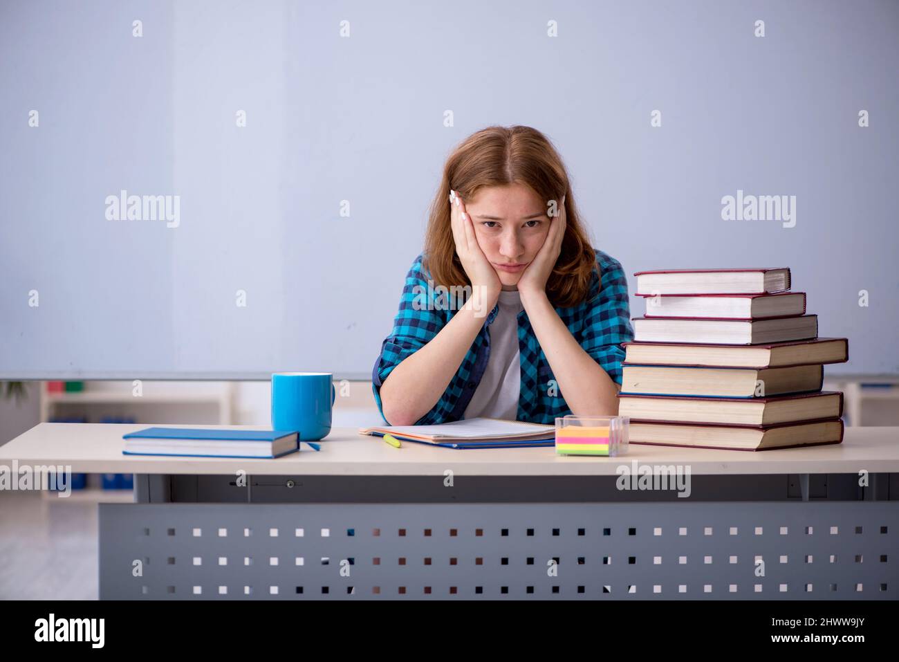 Young girl student preparing for exams in the classroom Stock Photo - Alamy