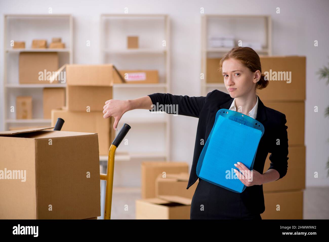 Female professional mover doing home relocation Stock Photo Alamy