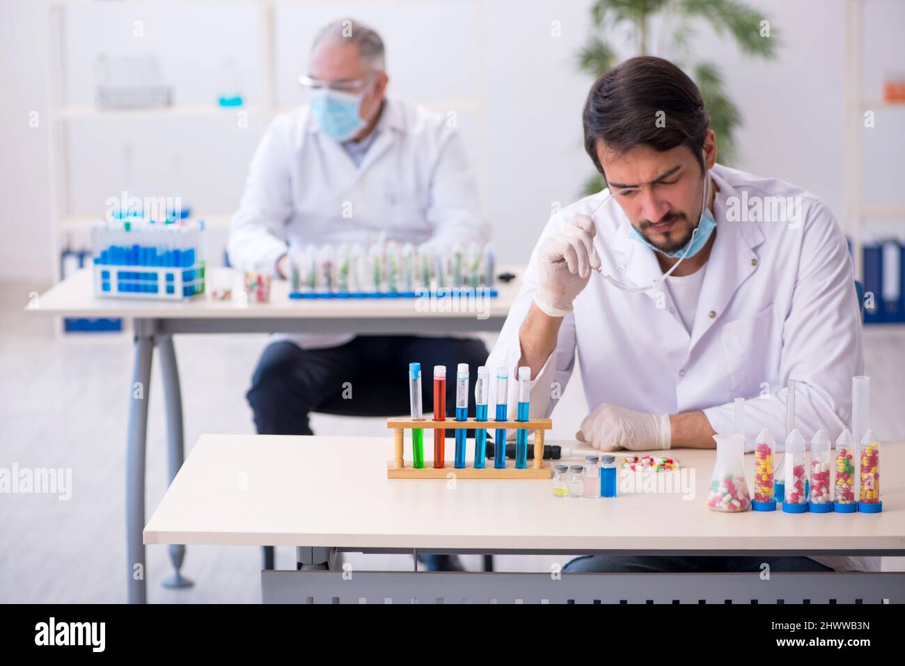 Two chemists in drugs synthesis concept at the lab Stock Photo Alamy