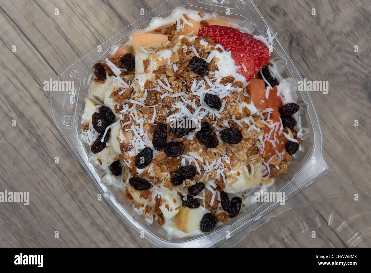 Overhead view of delicious and healthy fruit bowl snack with banana