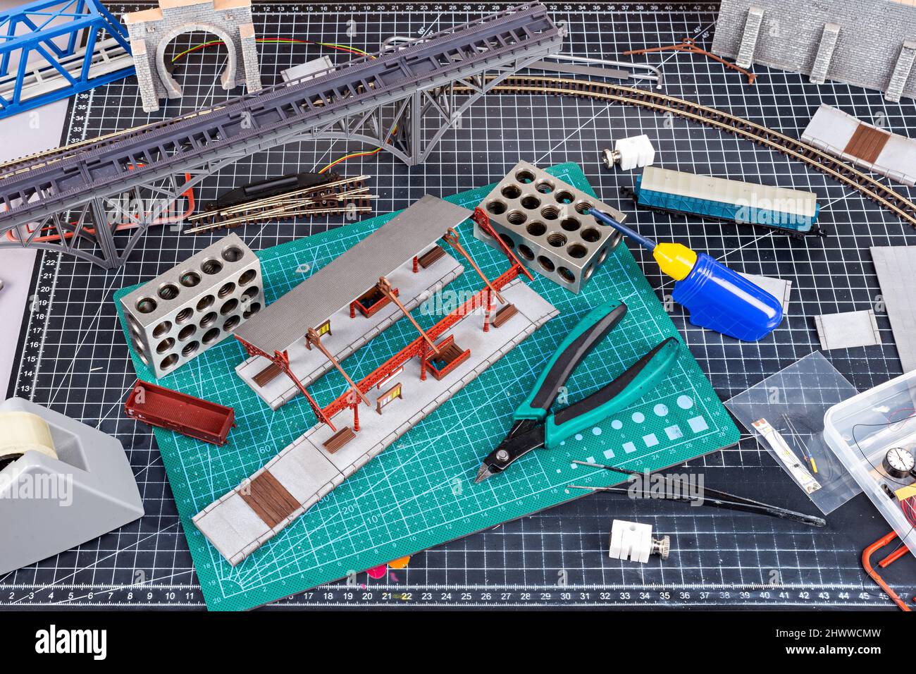construction of a model railroad layout. workbench with model railway