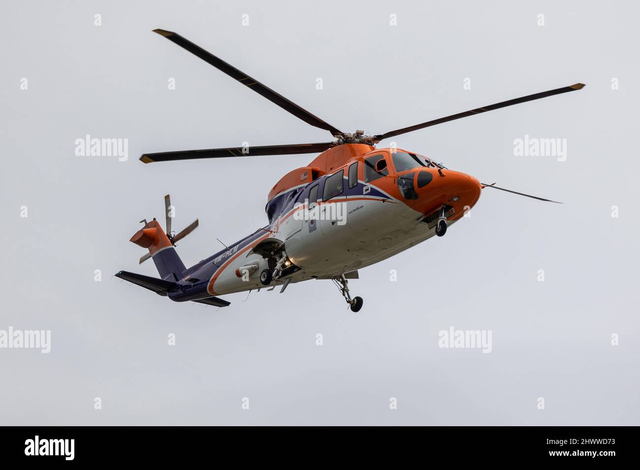 Kota Kinabalu, Sabah, Malaysia-October 24, 2021 : Helicopter model 9M-HLM flying on sky at Kota Kinabalu Skyline, Sabah, Malaysia Stock Photo