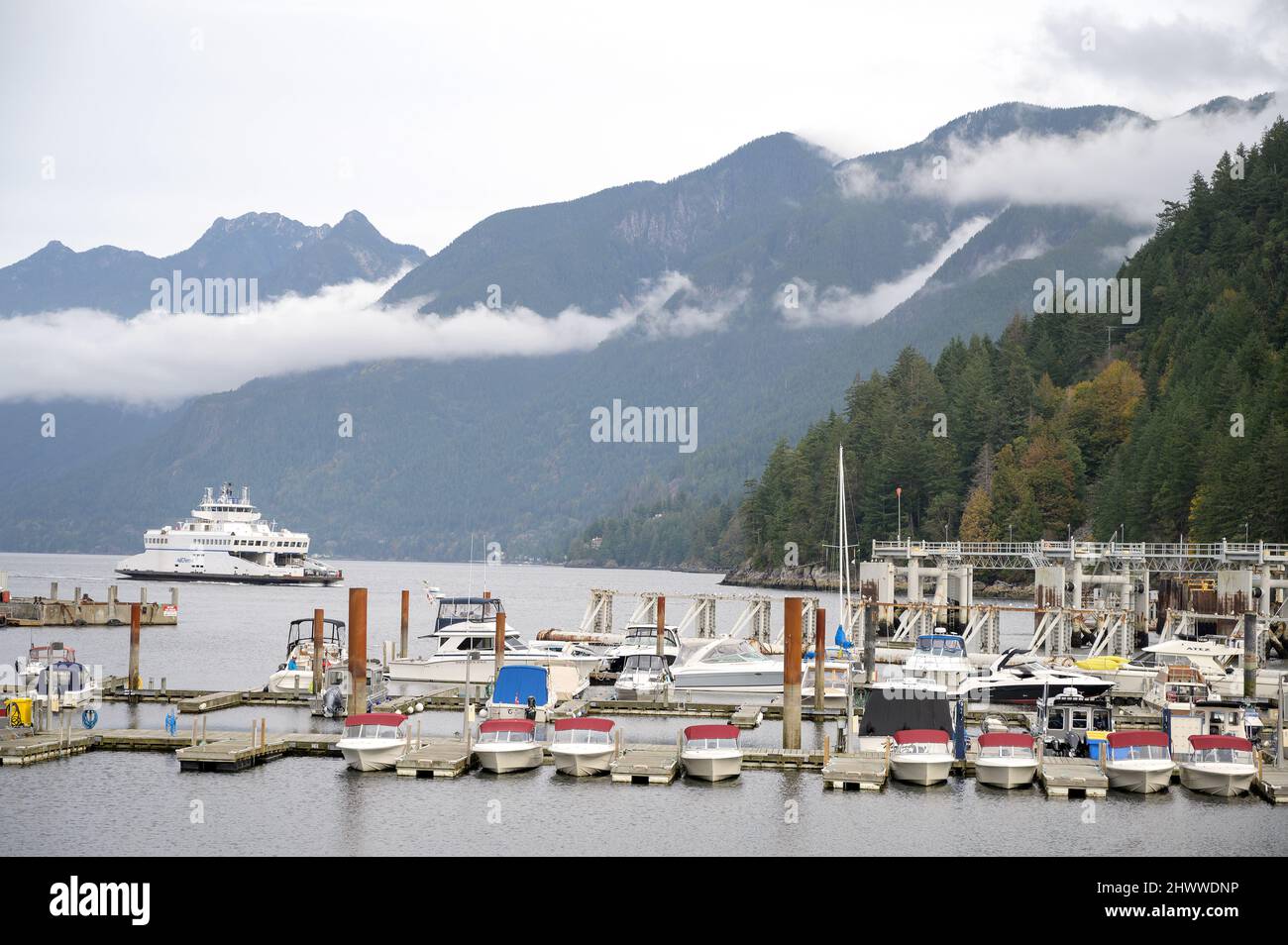 The Horseshoe Bay to Nanaimo BC ferry sailing into the ferry terminal at SewellÕs Marina.  West Vancouver, BC, Canada. Stock Photo