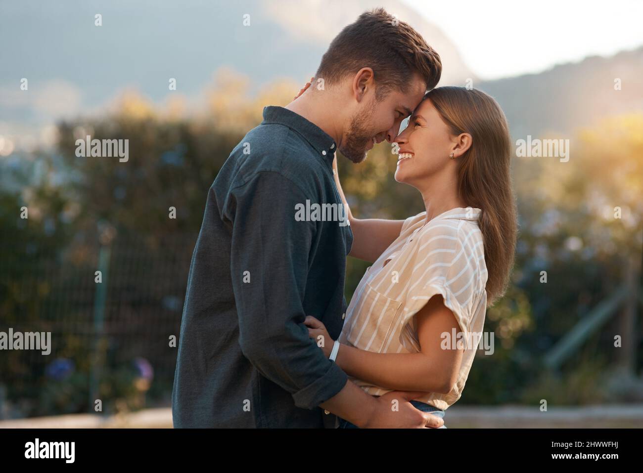 This kinda love only come around once. Shot of an affectionate couple spending the day outdoors. Stock Photo