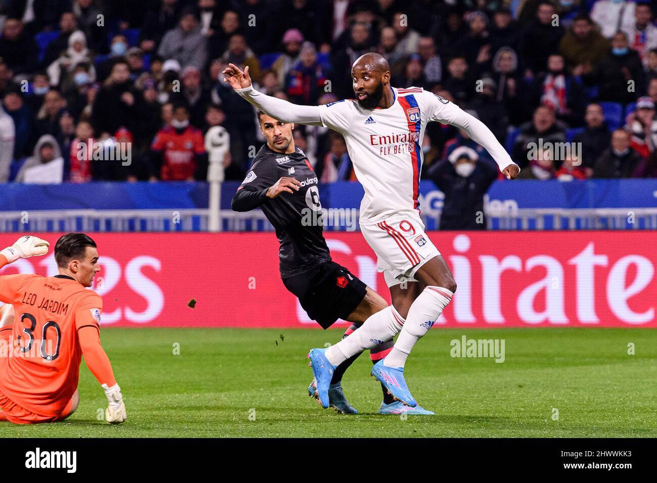 Lyon, France - February 27: Moussa Dembele of Lyon (R) attempts a kick while being defended by Leonardo Jardim of Lille (L) during the Ligue 1 Uber Ea Stock Photo