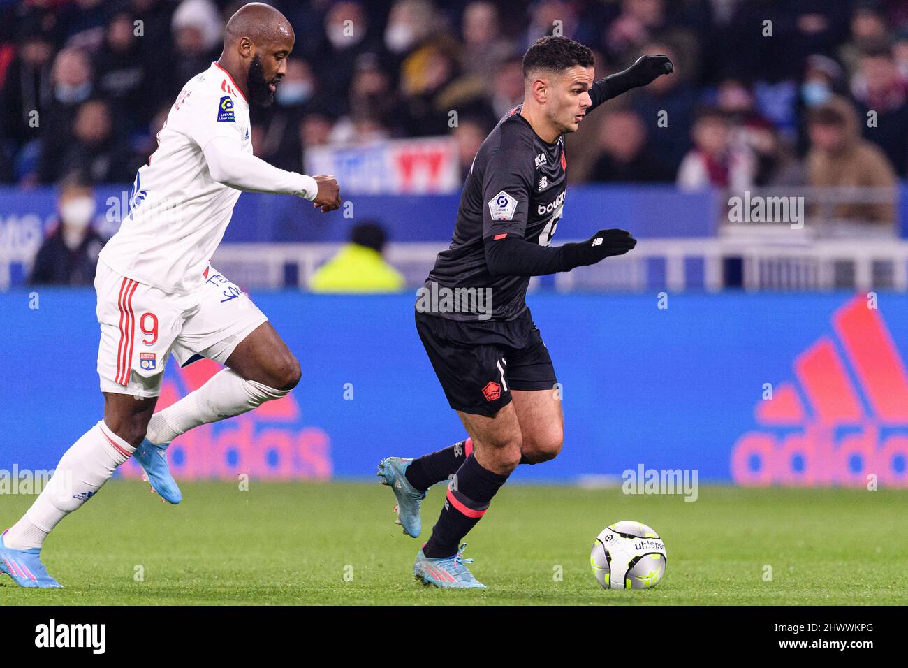 Lyon, France - February 27: Hatem Ben Arfa of Lille (R) is chased by Moussa Dembele of Lyon (L) during the Ligue 1 Uber Eats match between Olympique L Stock Photo