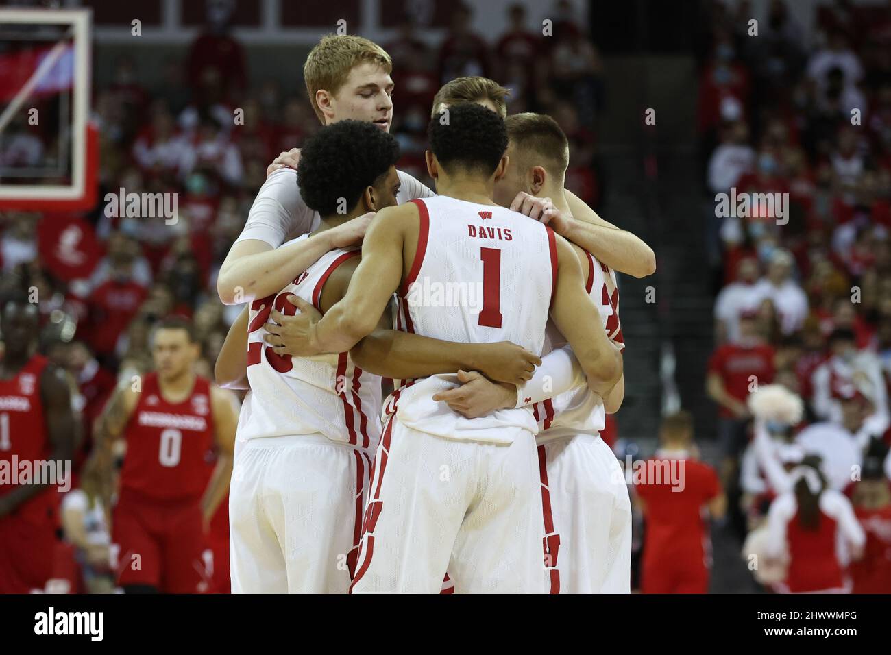March 6, 20, 2022: Wisconsin Badgers guard Johnny Davis (1), guard Brad Davison (34), guard Chucky Hepburn (23), forward Steven Crowl (22), and forward Tyler Wahl (5) huddle up before the opening tip of the NCAA Basketball game between the Nebraska Cornhuskers and the Wisconsin Badgers at the Kohl Center in Madison, WI. Darren Lee/CSM Stock Photo