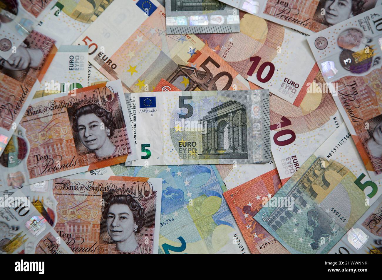 UK. 07th Mar, 2022. In this photo illustration, a collection British ten pound sterling and five, ten and fifty Euro banknotes are seen displayed. British pound hit to its lowest against