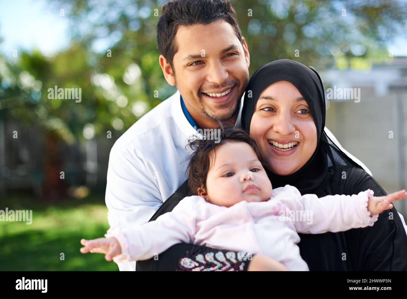 Were a blessed family. Portrait of a muslim family enjoying a day outside. Stock Photo