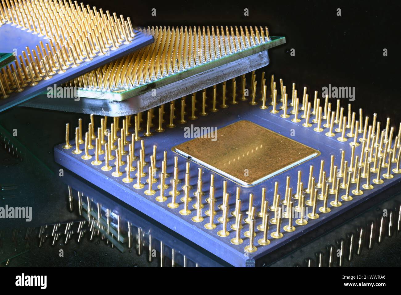 Multiple Generations of Computer CPU's in a close up showing the golden