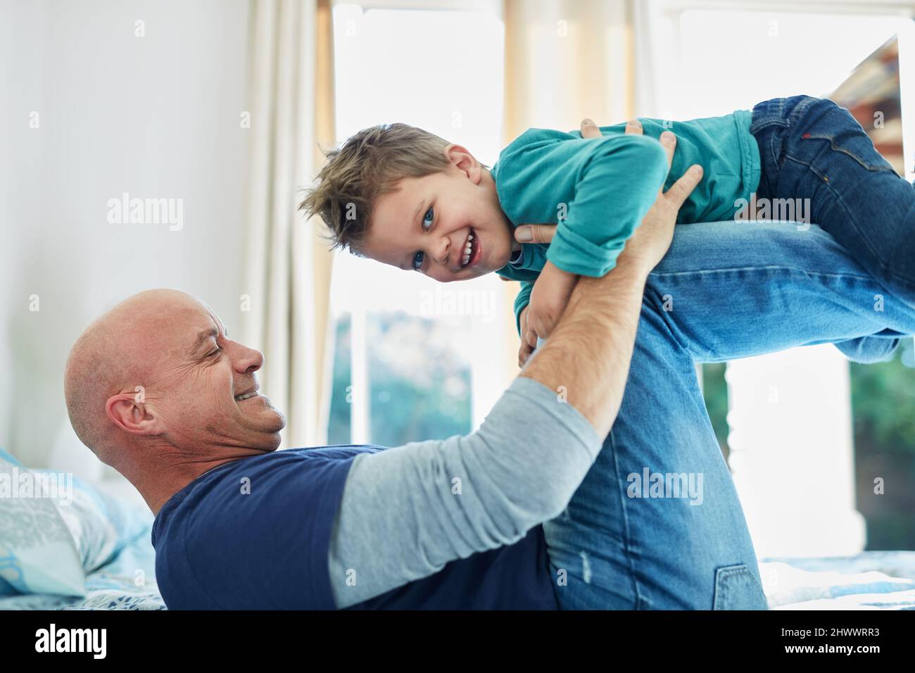 Bonding with his boy. Cropped shot of a father and son bonding together at home. Stock Photo