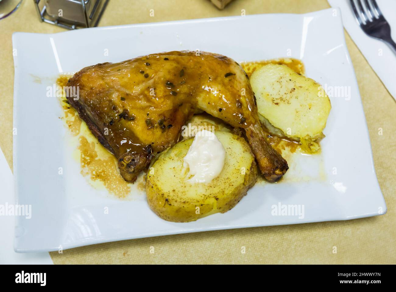 Baked chicken legs with potatoes Stock Photo - Alamy