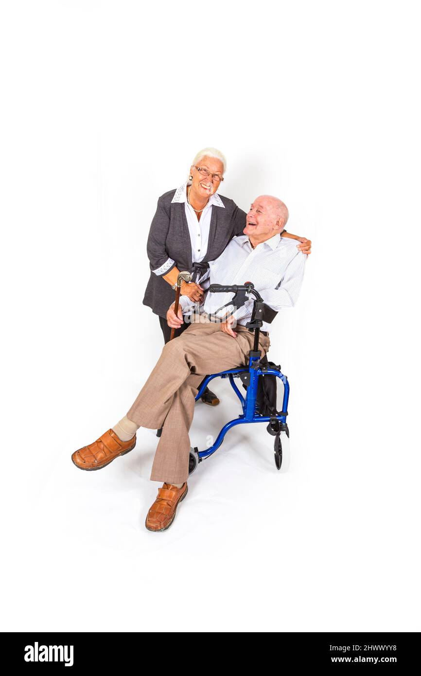 happy senior couple with man in wheelchair Stock Photo