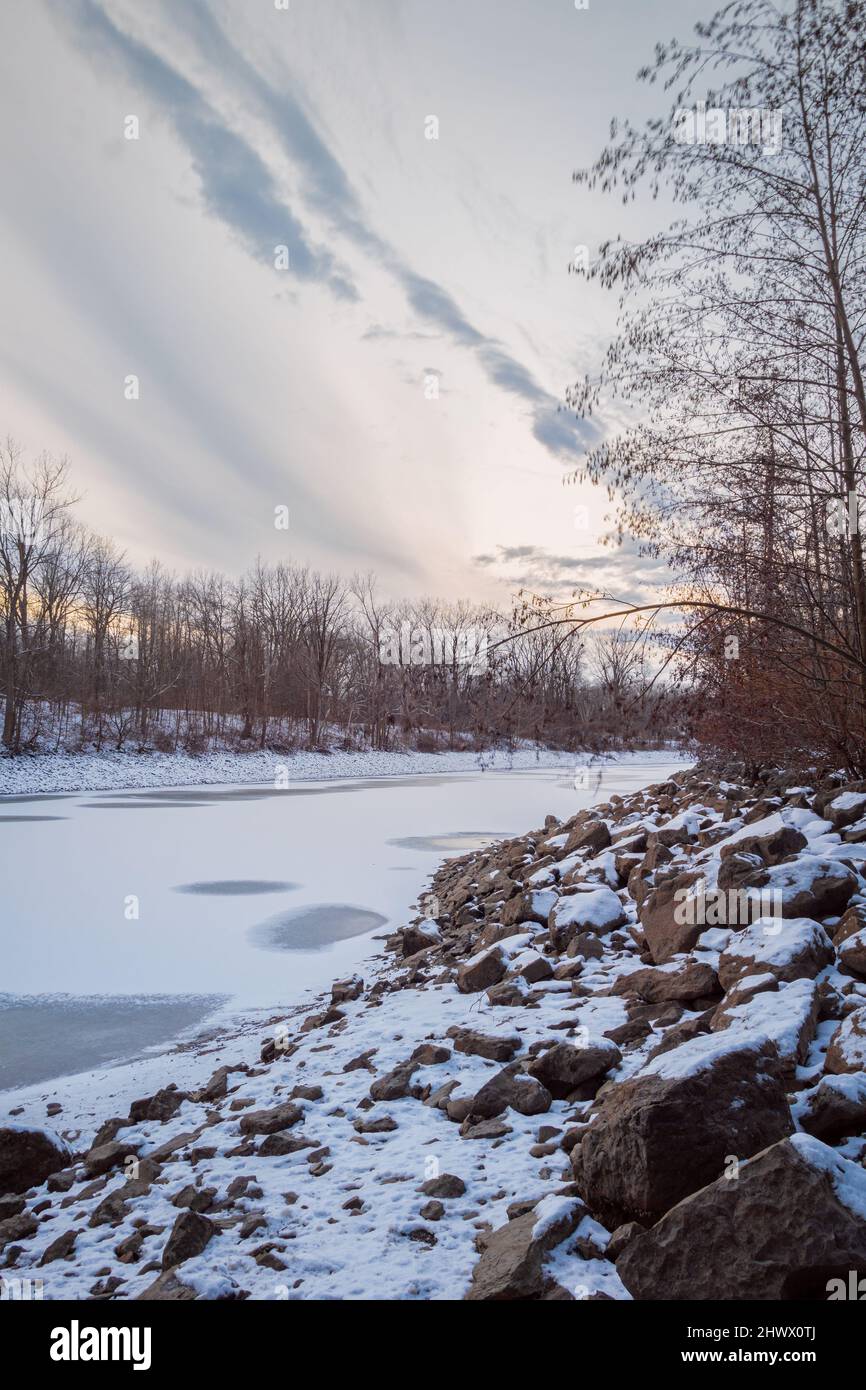 Vertical Sunrise Winter Scene of Mohawk River in Oneida County, New York. Stock Photo