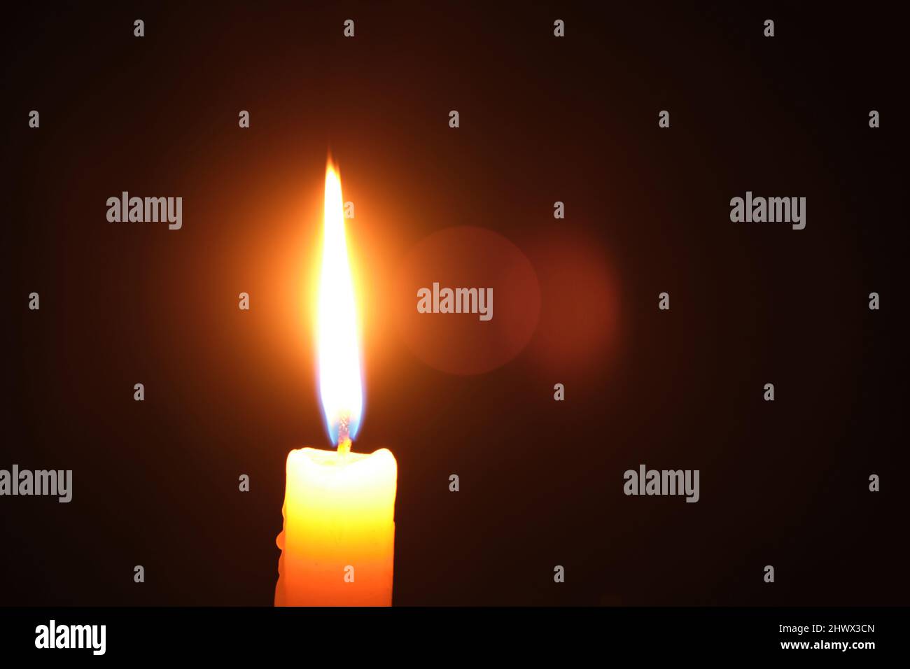 Flame burning candle black background.Concept memory and sorrow Stock