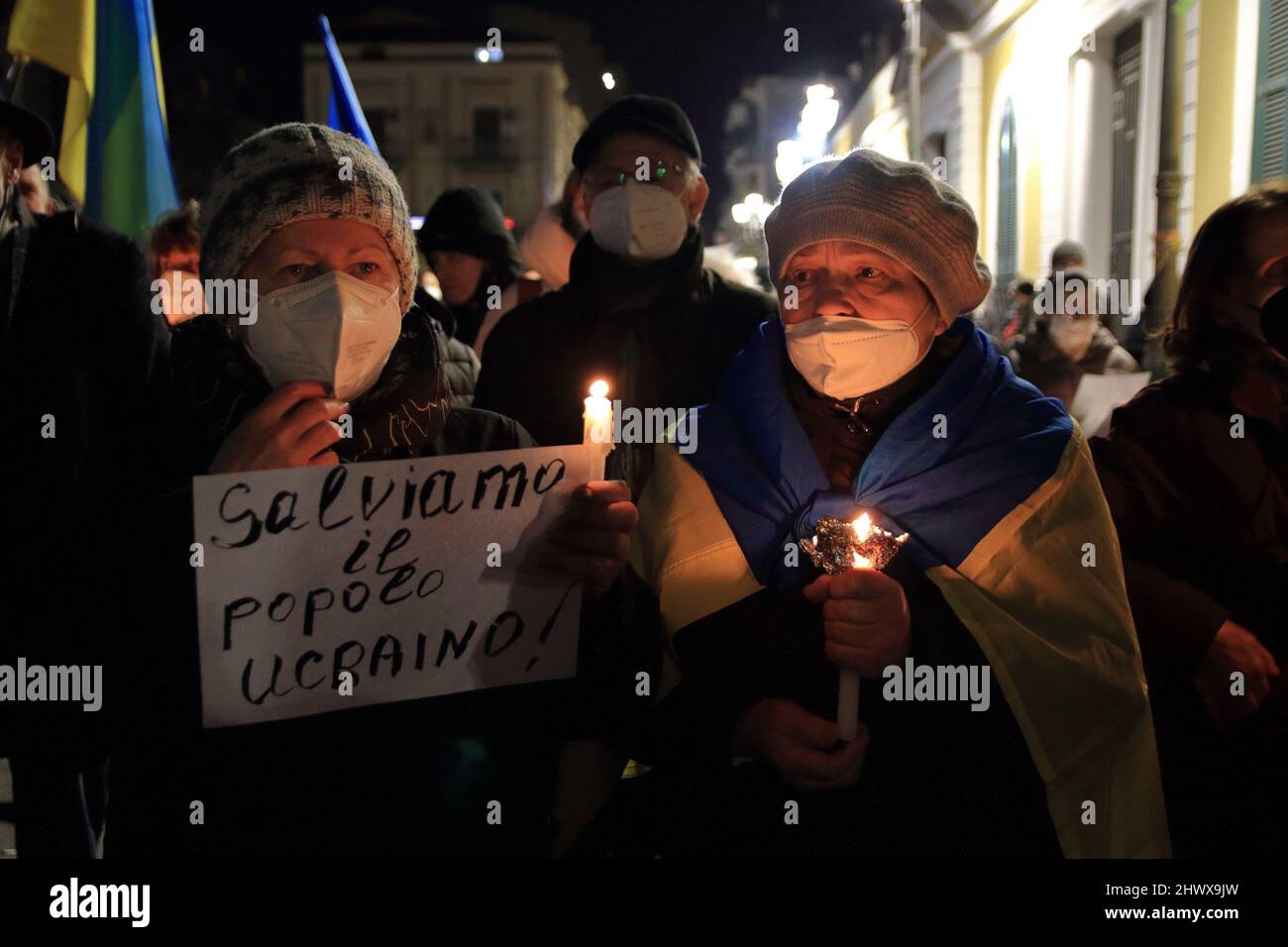 Angri, Italy. 07th Mar, 2022. Ukrainian women light candles during the