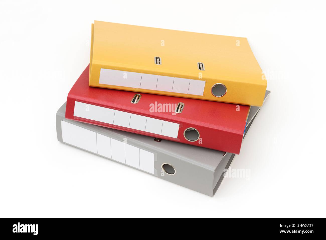 Yellow, gray and red office folder on white background. Stock Photo