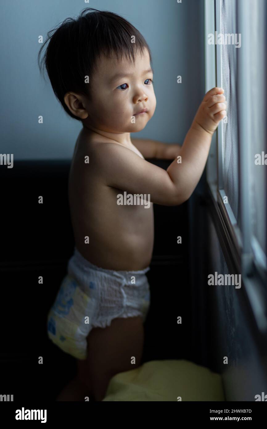 cute Asian Chinese 1 years old Asian Chinese baby boy playing around