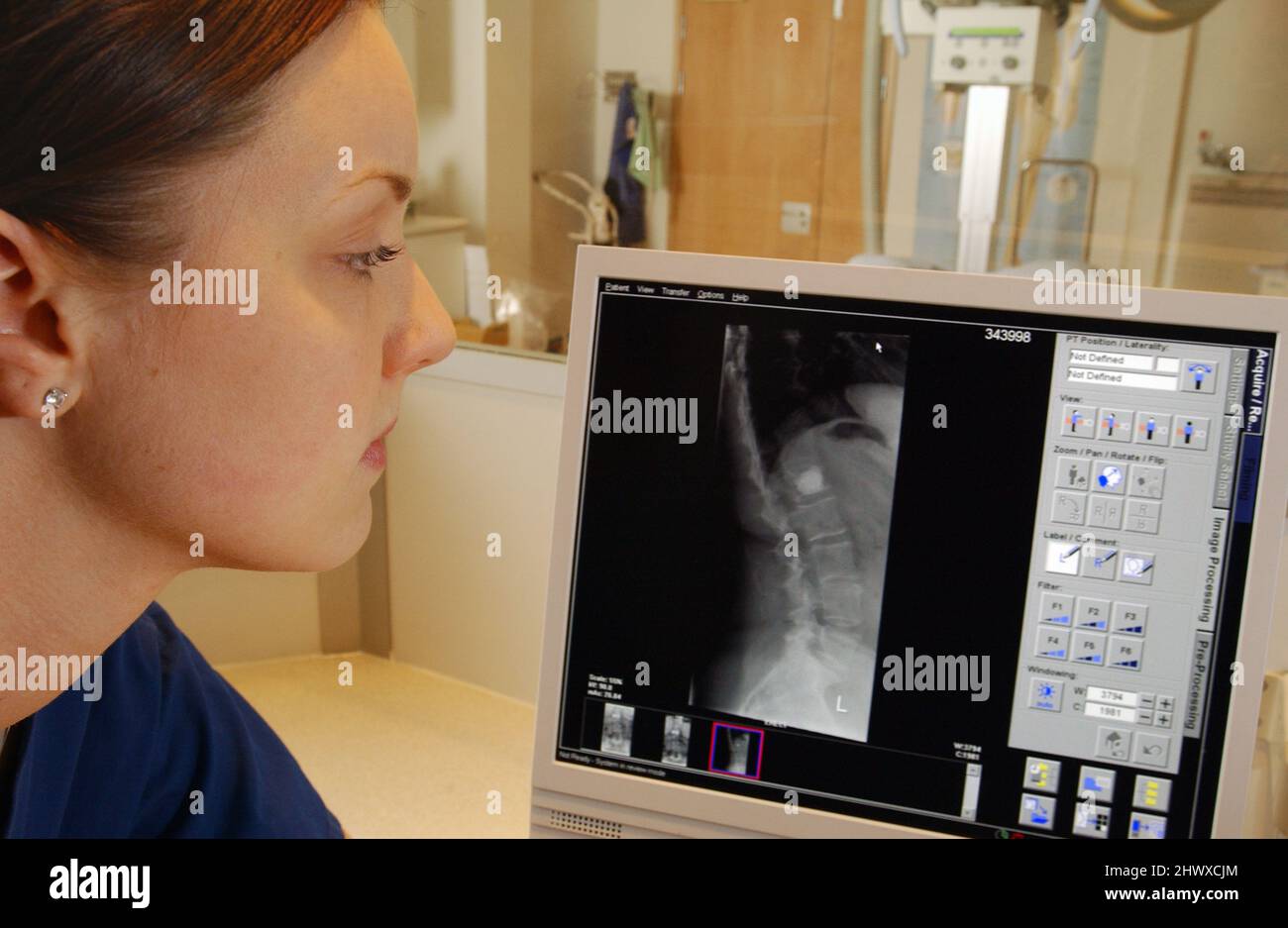 Radiographer in a xray control room. (MODEL RELEASED Stock Photo Alamy