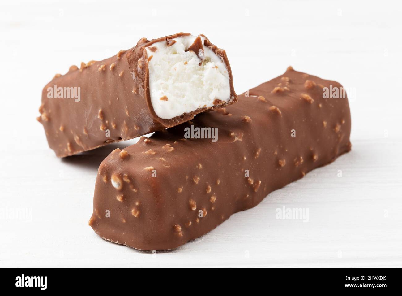 Two chocolate ice cream bars on white background close up macro shot Stock Photo