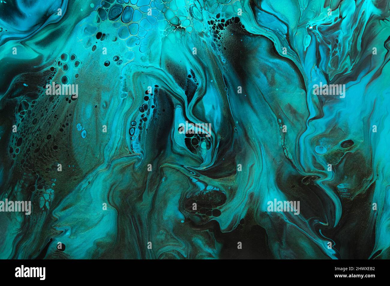 Fluid Art. Green and blue abstract wave swirls on black background ...