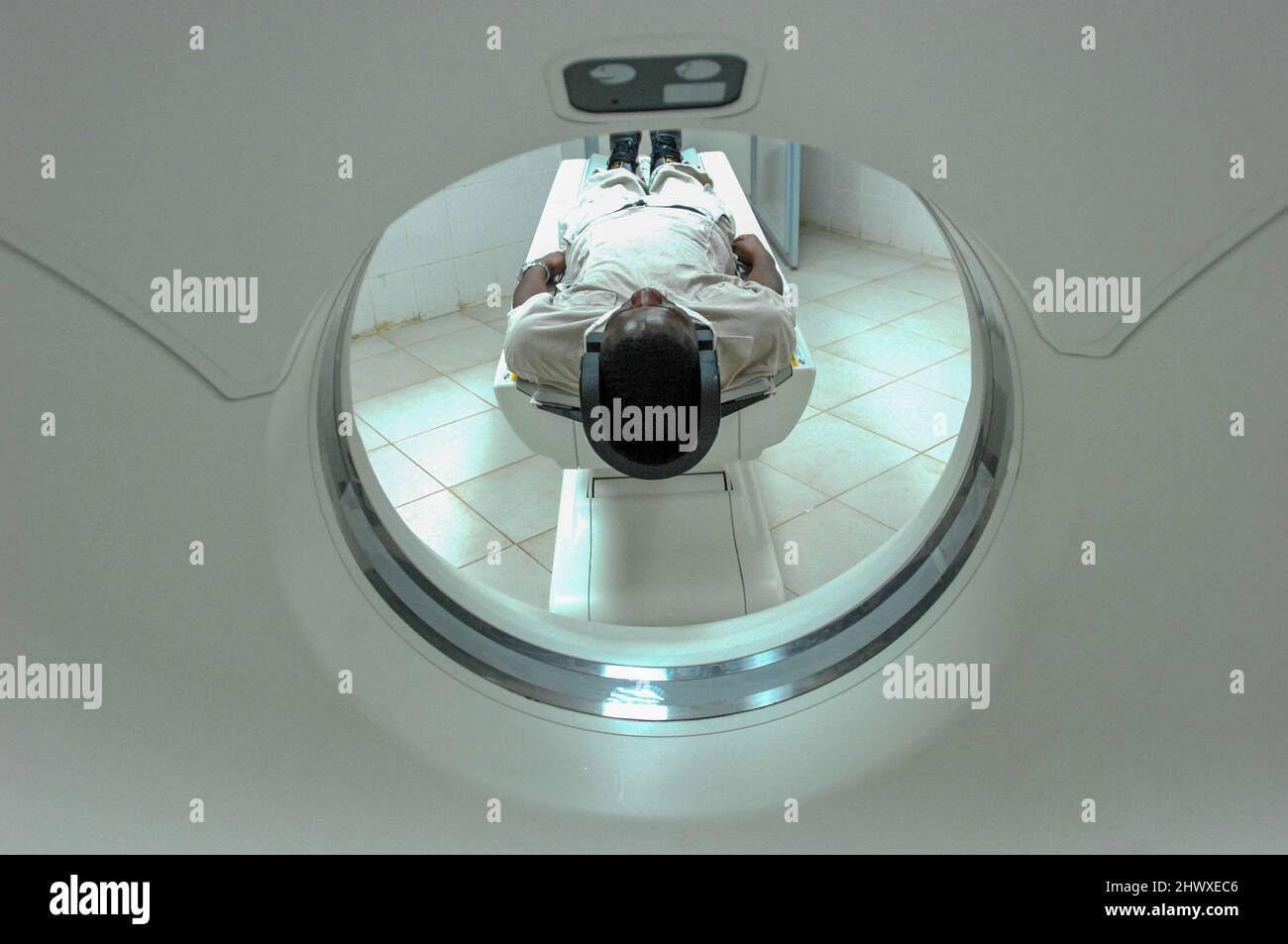 Patient undergoing a CT (Computd Tomography or CAT) scan of his head. Stock Photo