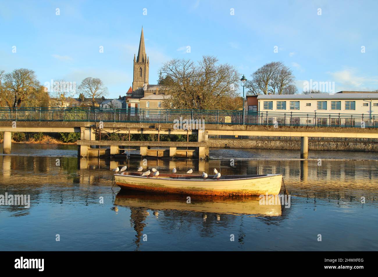 Sligo, Ireland in spring featuring small rowboat in still waters of Garavogue river Stock Photo