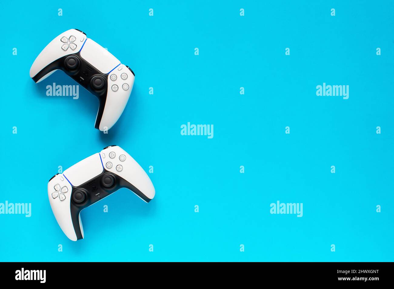 Realistic game console of the new generation Playstation 5 in vector.  Realistic Dualsenses ps5 gamepad in vector. on a blue background. Stock  Vector