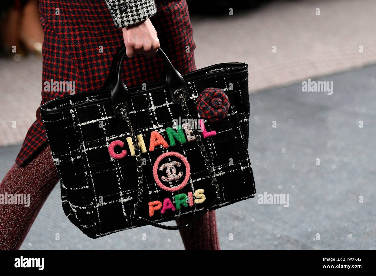 A model presents a bag creation by designer Virginie Viard as part of her  Fall-Winter 2022/2023 Women's ready-to-wear collection show for fashion  house Chanel during Paris Fashion Week in Paris, France, March