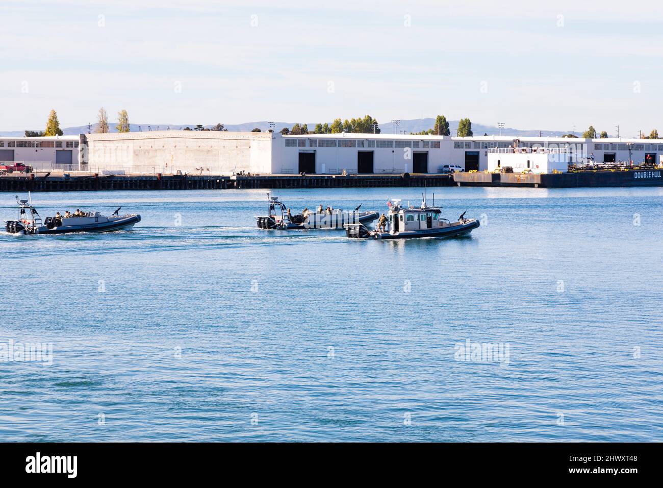 3 US Coast Guard rigid raider ASIS boats patrol the Oakland Inner Harbor on exercise. Oakland, San Francisco, California, USA Stock Photo